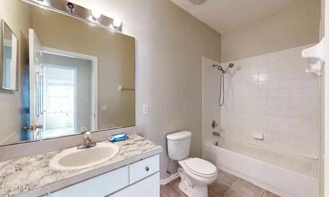 a bathroom with a shower and a tub