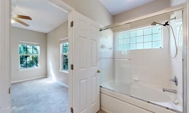 a view of an empty room with a window