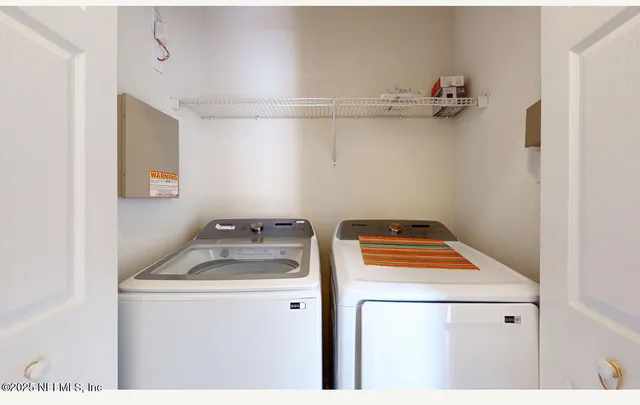 a kitchen with a sink a stove and cabinets