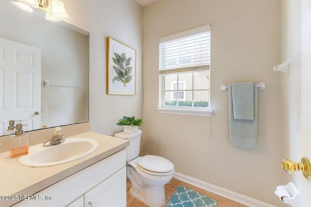 a view of livingroom with furniture and a potted plant