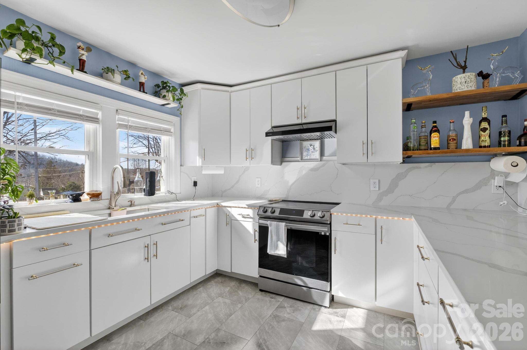 a kitchen with cabinets and window