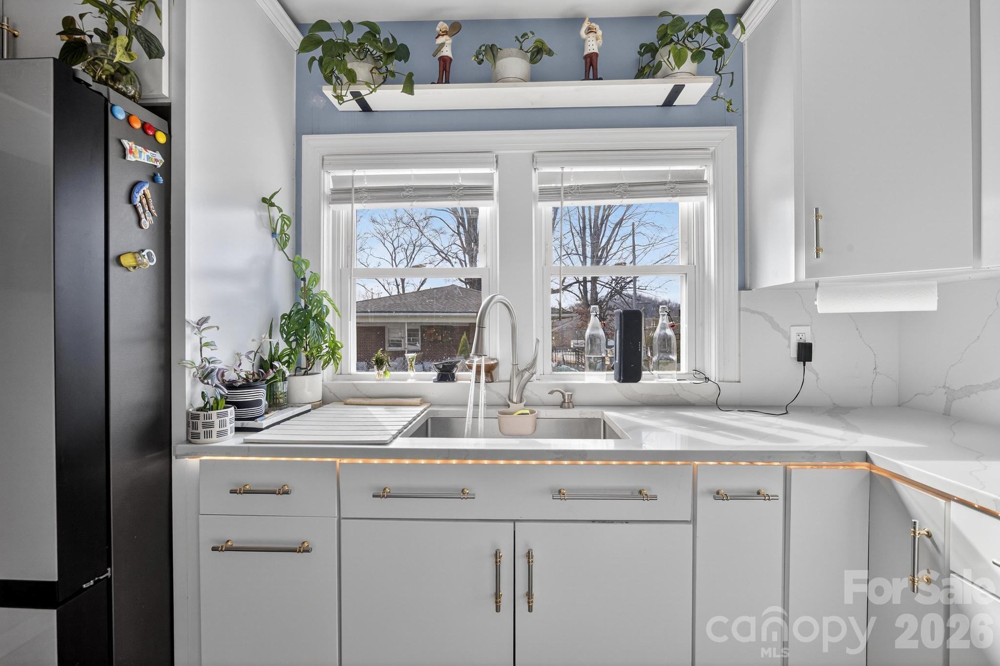 105 Countryside Drive Southwest Lenoir, NC 28645 - Photo 11 of 43 a bathroom with a sink and a window