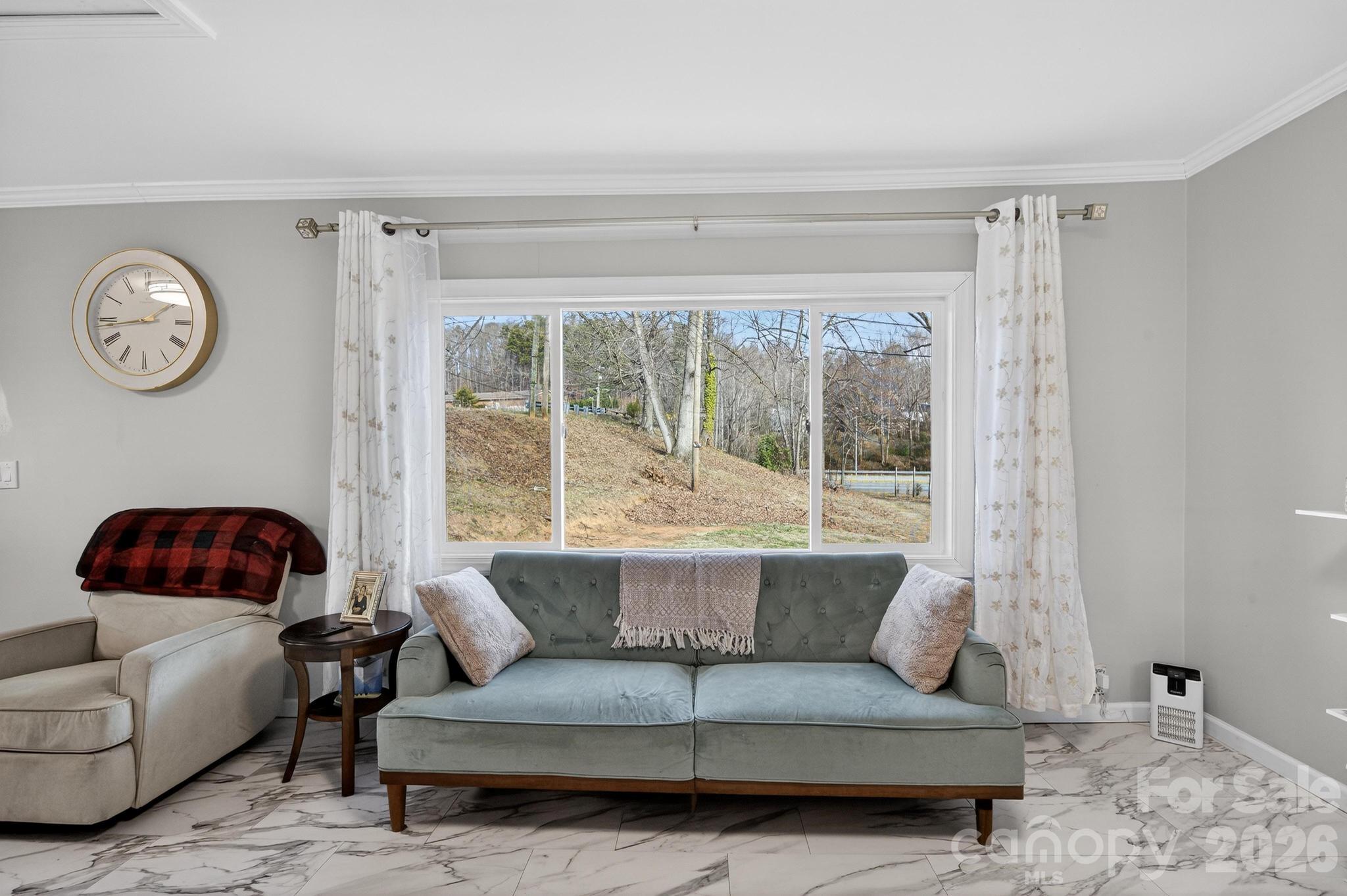 105 Countryside Drive Southwest Lenoir, NC 28645 - Photo 14 of 43 a living room with furniture and a large window