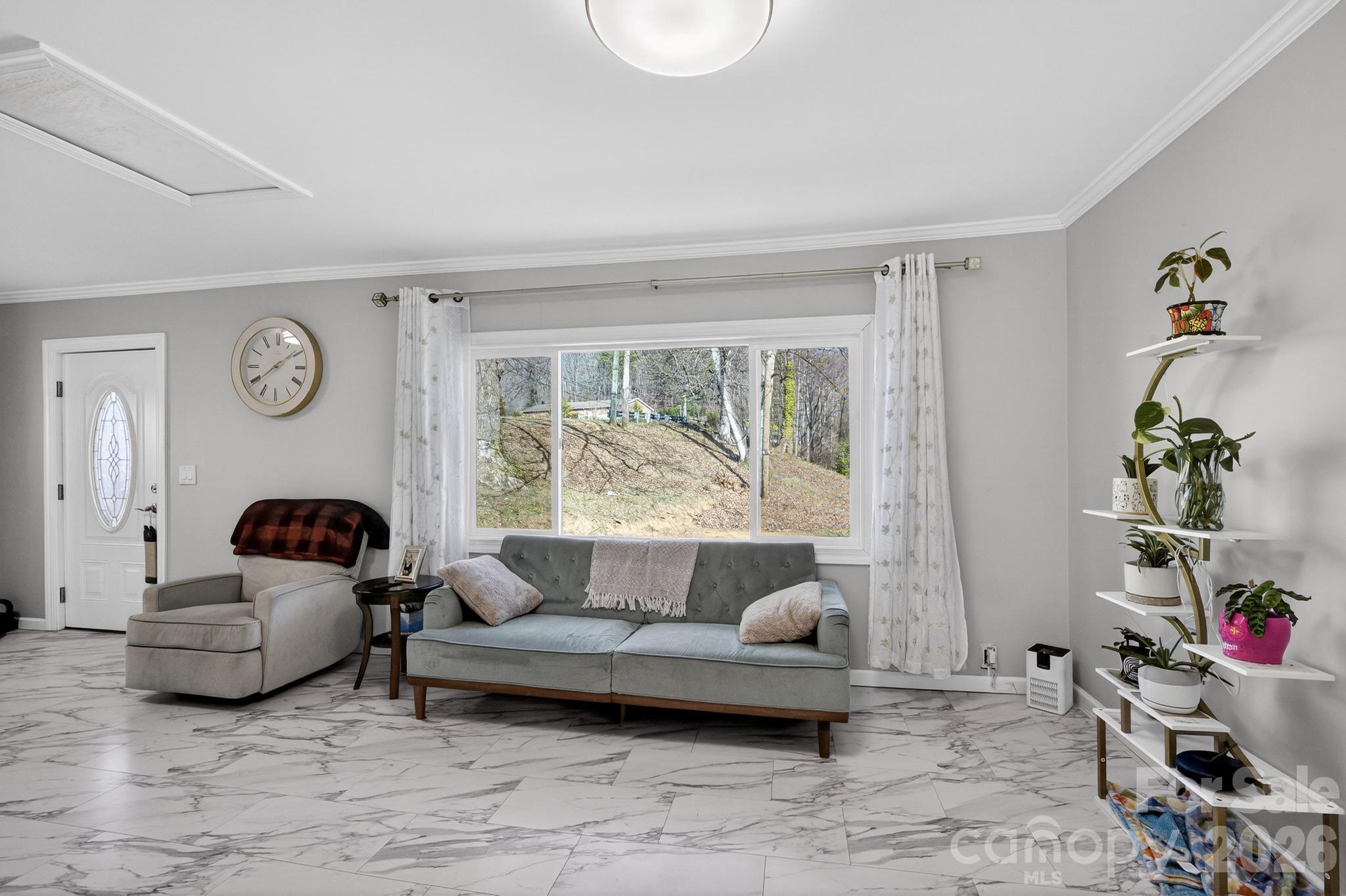 105 Countryside Drive Southwest Lenoir, NC 28645 - Photo 16 of 43 a living room with furniture and a window