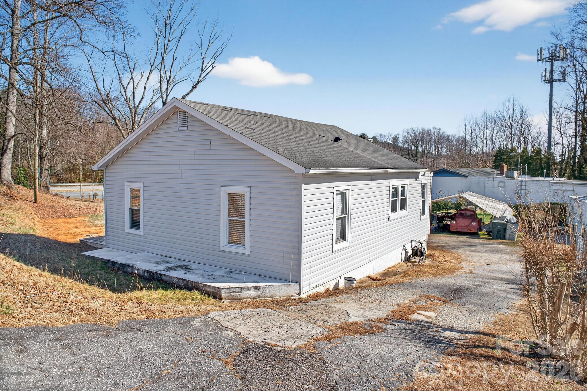 105 Countryside Drive Southwest Lenoir, NC 28645 - Photo 21 of 43 a view of a house with a yard covered in snow