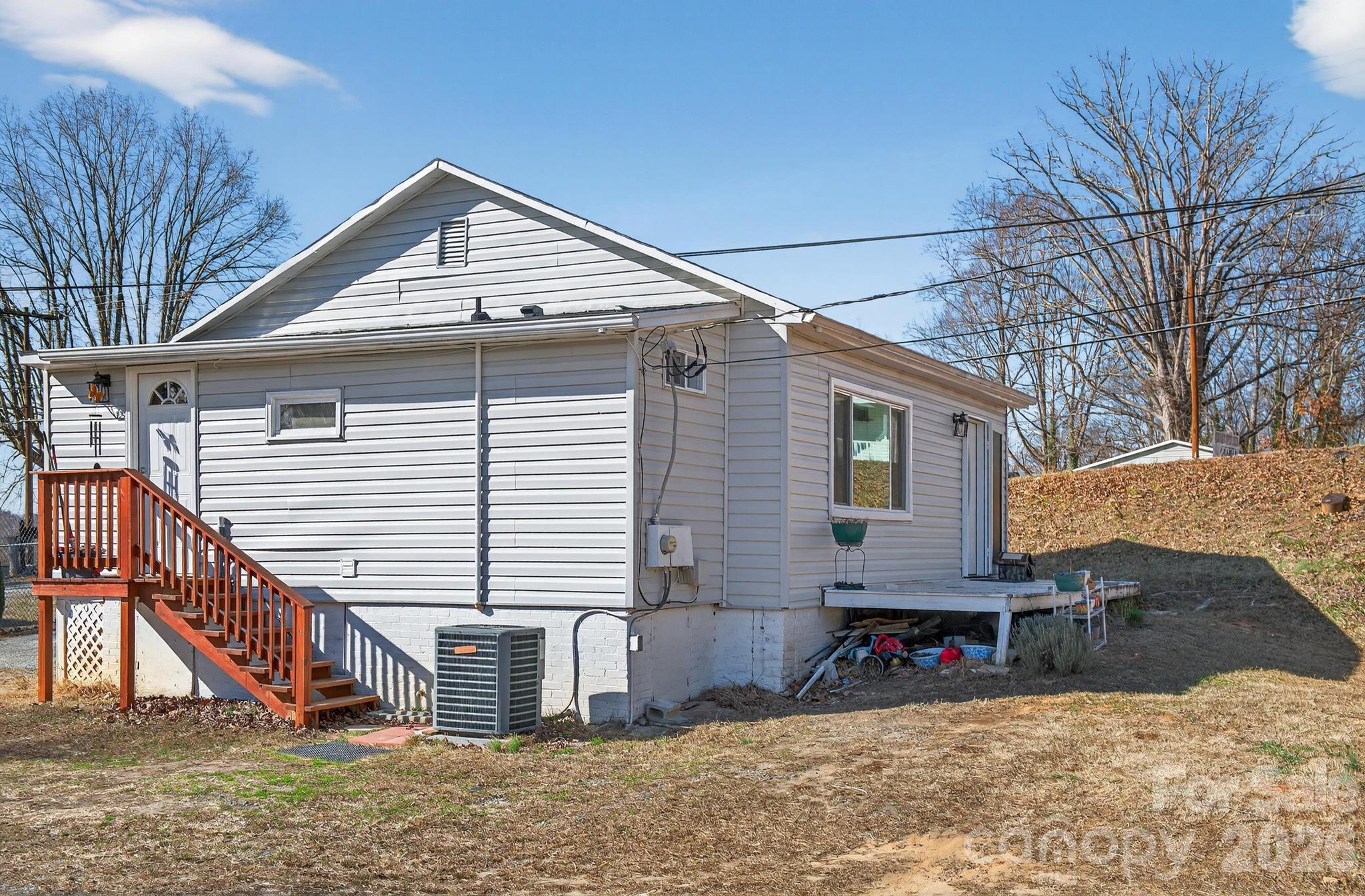 105 Countryside Drive Southwest Lenoir, NC 28645 - Photo 24 of 43 a view of a house with a yard