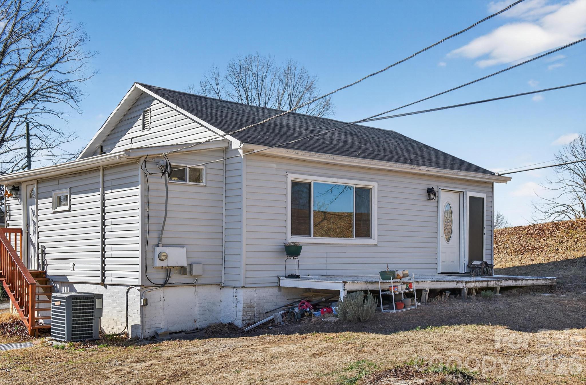 105 Countryside Drive Southwest Lenoir, NC 28645 - Photo 25 of 43 a view of a house with a patio