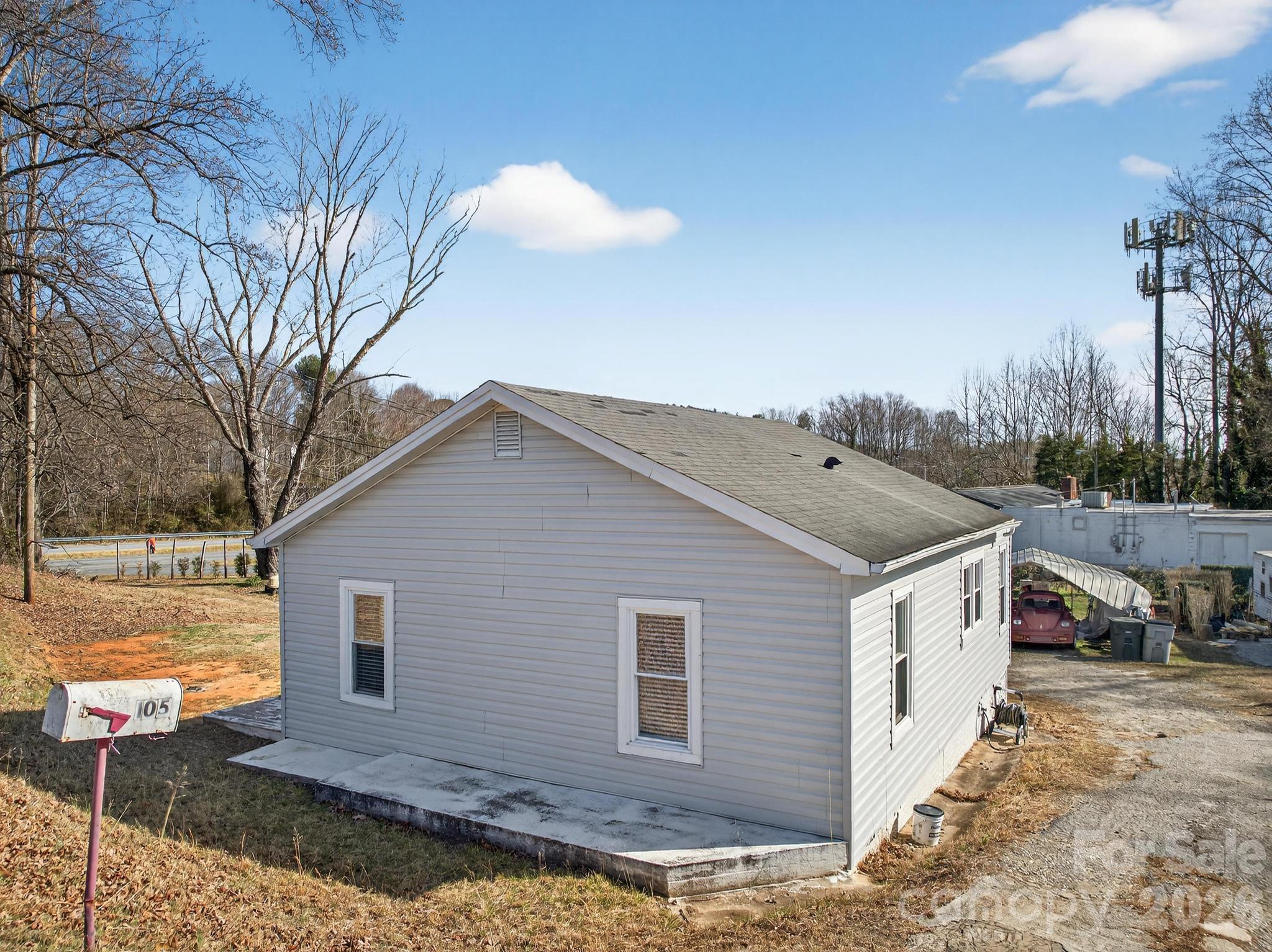 105 Countryside Drive Southwest Lenoir, NC 28645 - Photo 29 of 43 a view of a house with a yard