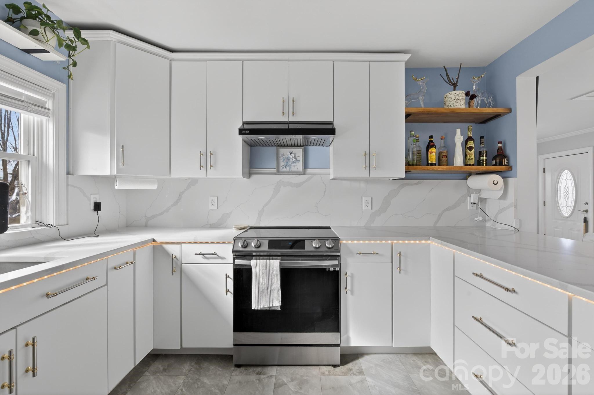 105 Countryside Drive Southwest Lenoir, NC 28645 - Photo 3 of 43 a kitchen with cabinets appliances and a sink