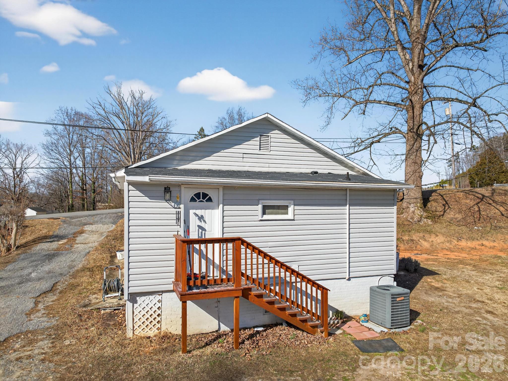 105 Countryside Drive Southwest Lenoir, NC 28645 - Photo 32 of 43 a view of a house with a yard