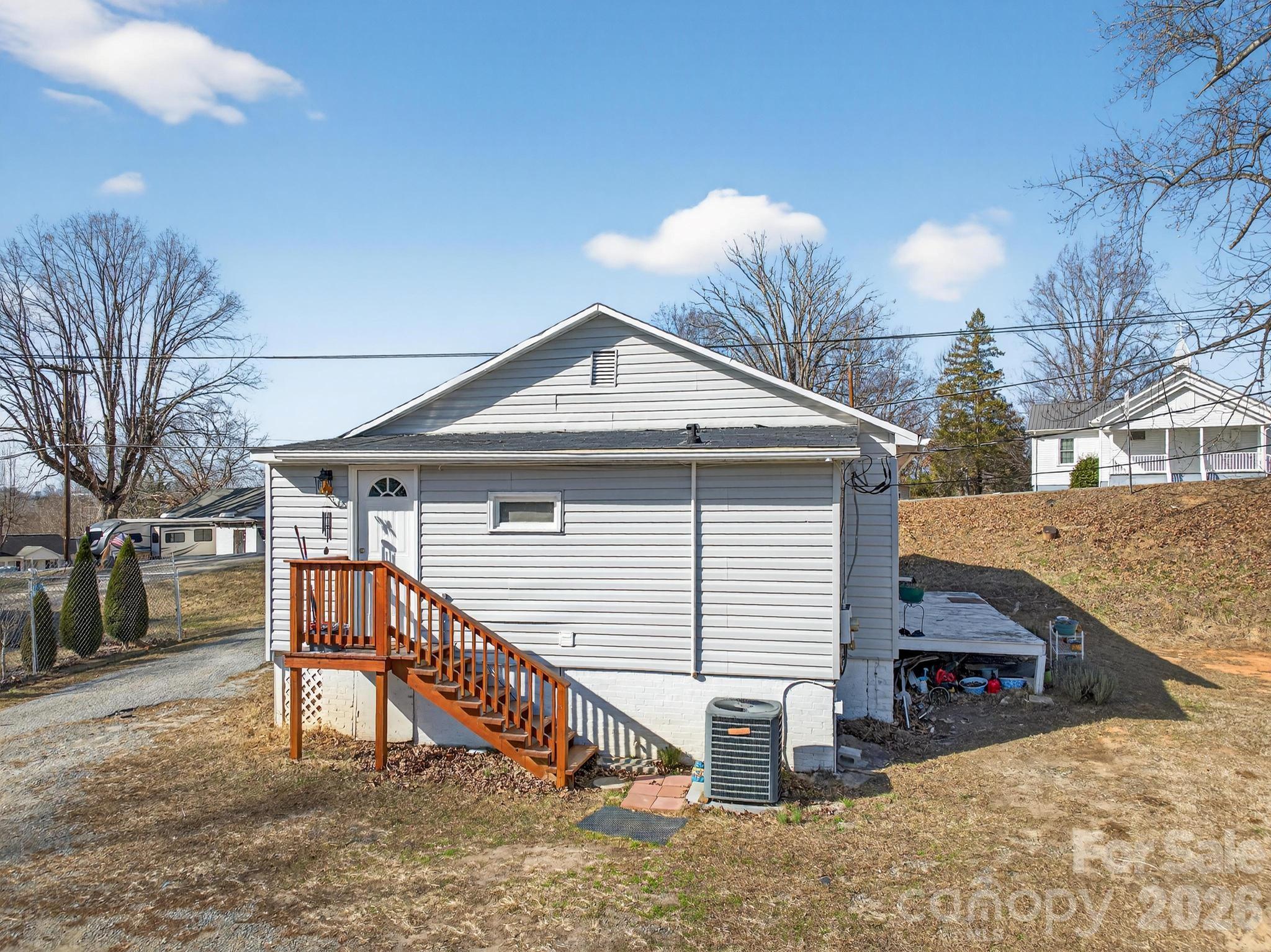 105 Countryside Drive Southwest Lenoir, NC 28645 - Photo 33 of 43 a view of a house with a yard