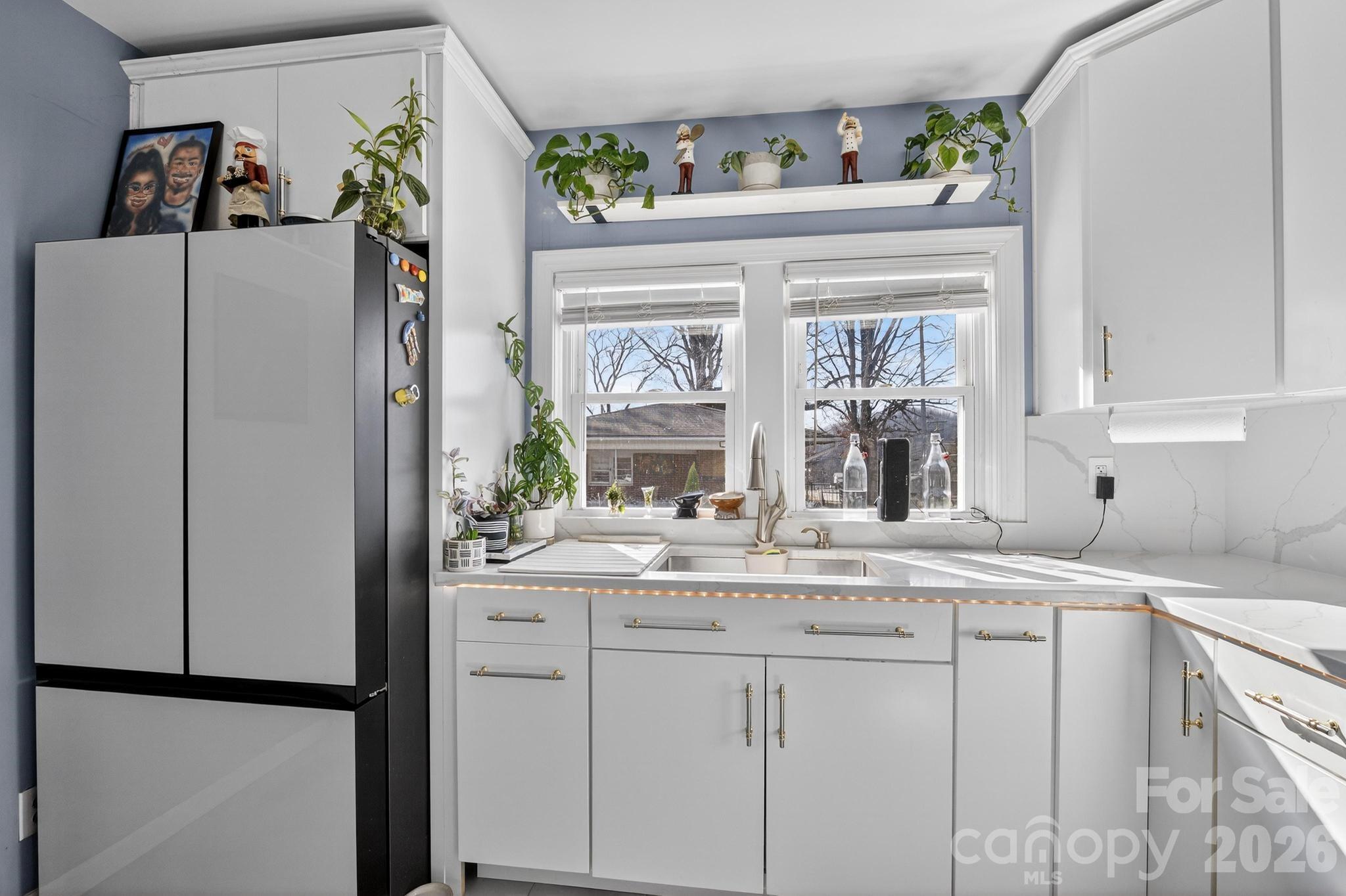 105 Countryside Drive Southwest Lenoir, NC 28645 - Photo 5 of 43 a kitchen with stainless steel appliances granite countertop a refrigerator and a sink
