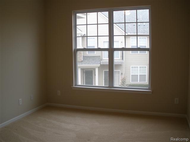 10110 Ridge Run Street, Unit 27 Howell, MI 48855 - Photo 10 of 13 2nd bedroom