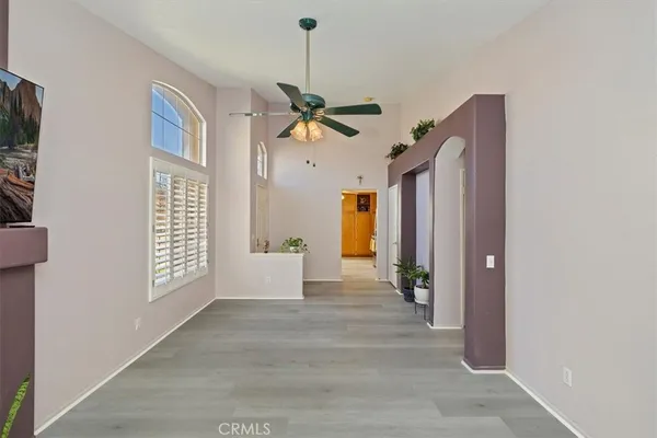 a kitchen with granite countertop a sink a counter top space and stainless steel appliances