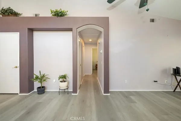 a room with a bed and a chandelier