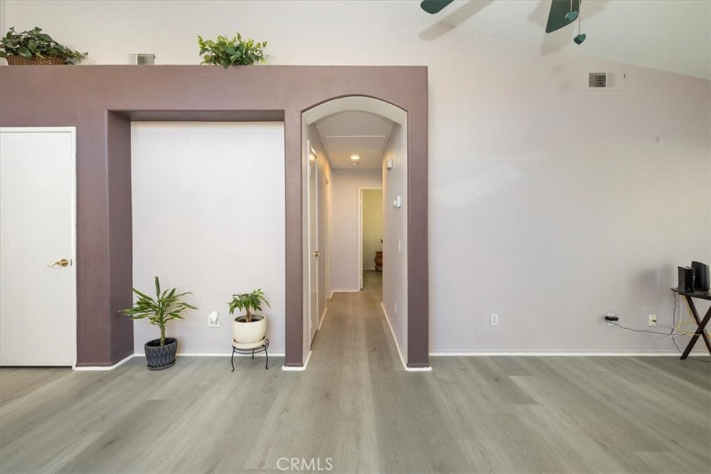 5509 Rodriguez Avenue Banning, CA 92220 - Photo 18 of 36 a view of a room with wooden floor and potted plant