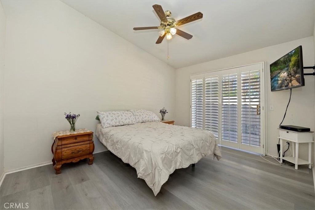 5509 Rodriguez Avenue Banning, CA 92220 - Photo 21 of 36 a bedroom with a bed and a chair with the potted plant
