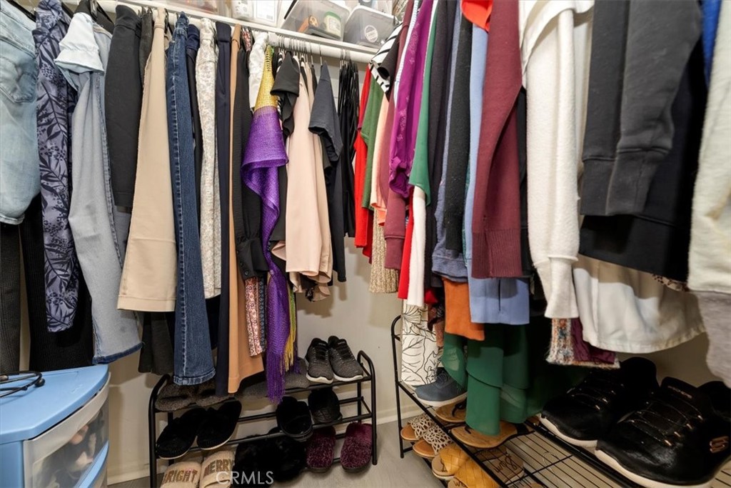 5509 Rodriguez Avenue Banning, CA 92220 - Photo 26 of 36 a view of walk in closet with clothes and shoes