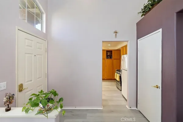 an empty room with windows and entrance