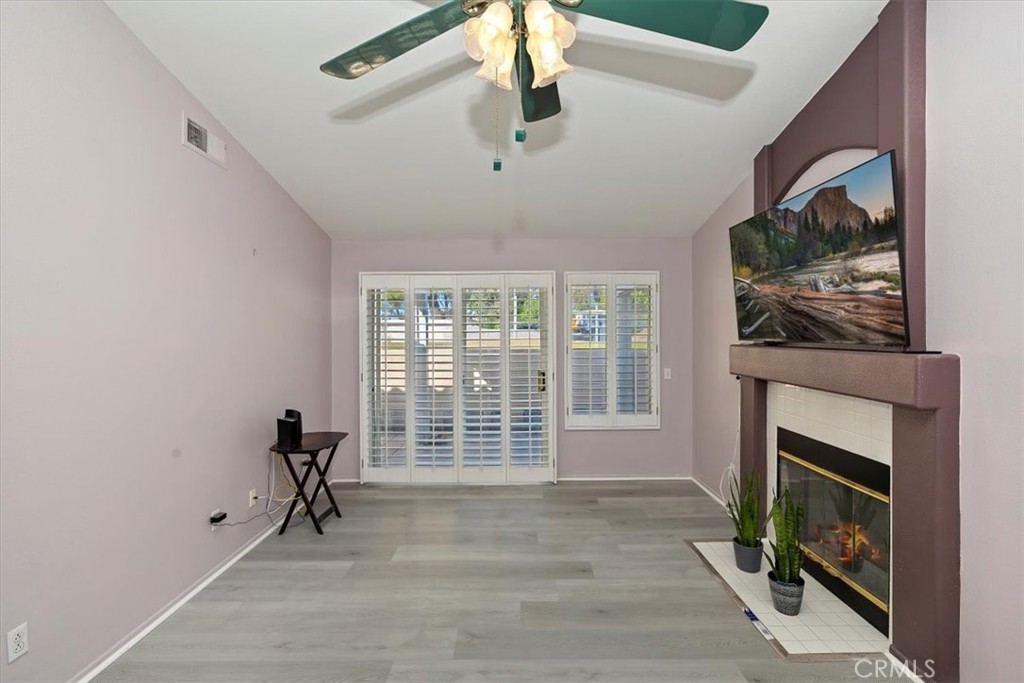 5509 Rodriguez Avenue Banning, CA 92220 - Photo 7 of 36 a view of an empty room with a window and a fireplace