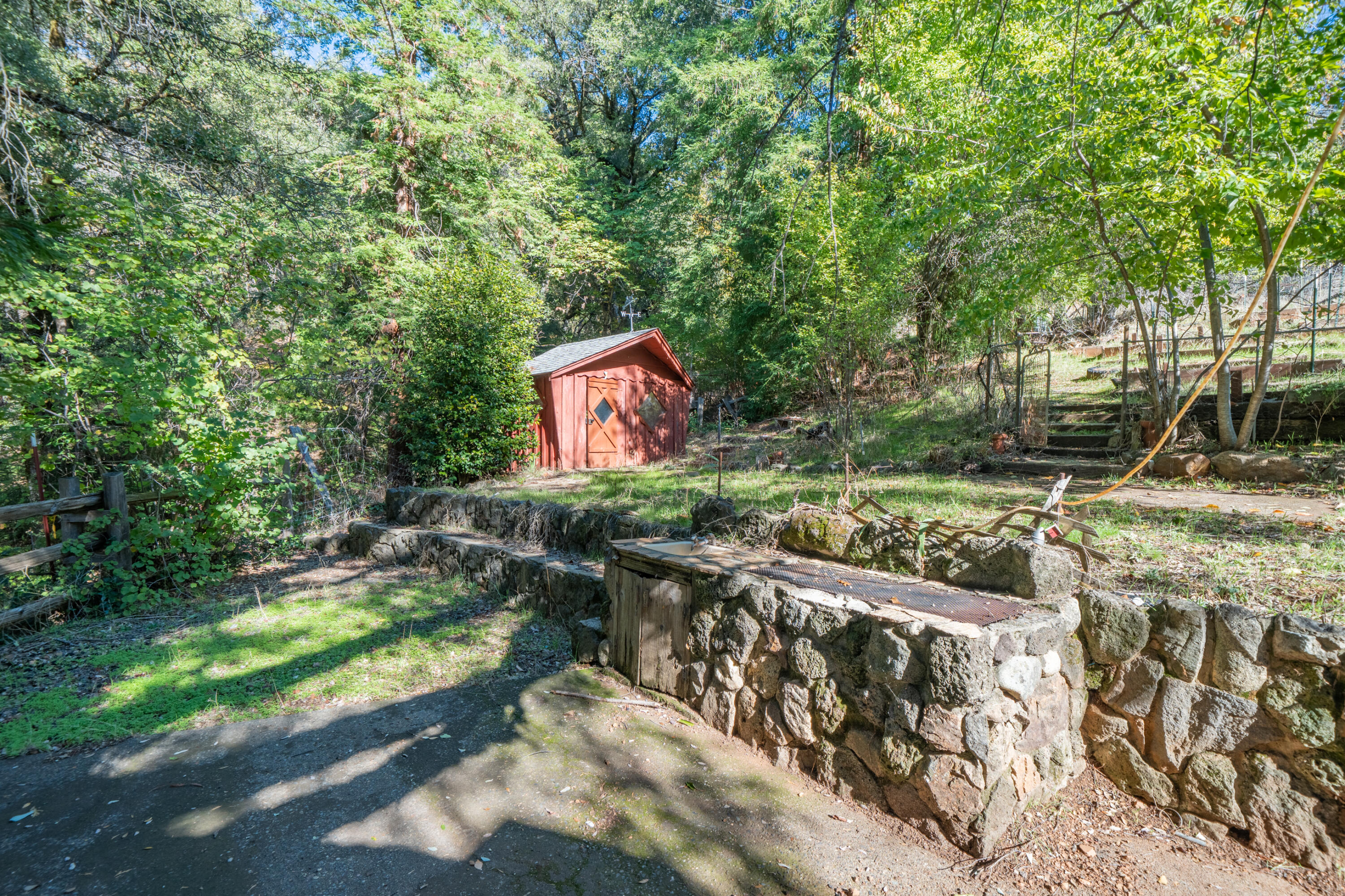 20389 Our Road Lakehead, CA 96051 - Photo 42 of 92 a backyard of a house with yard and outdoor seating
