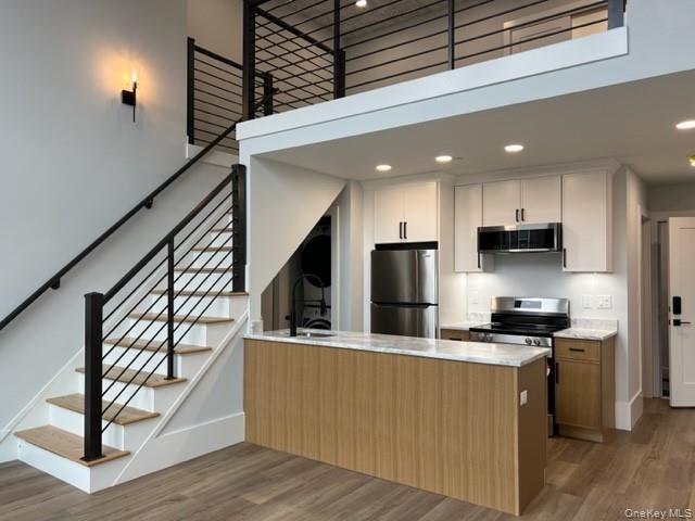 42 North Main Street, Unit 6 Florida, NY 10921 - Photo 1 of 7 a kitchen with stainless steel appliances kitchen island granite countertop a stove a sink and a refrigerator