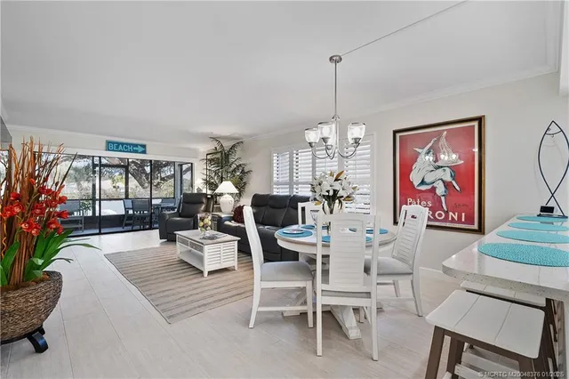 a view of a dining room with furniture window and outdoor view