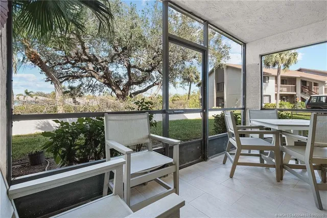 a view of a two chair and tables in the balcony