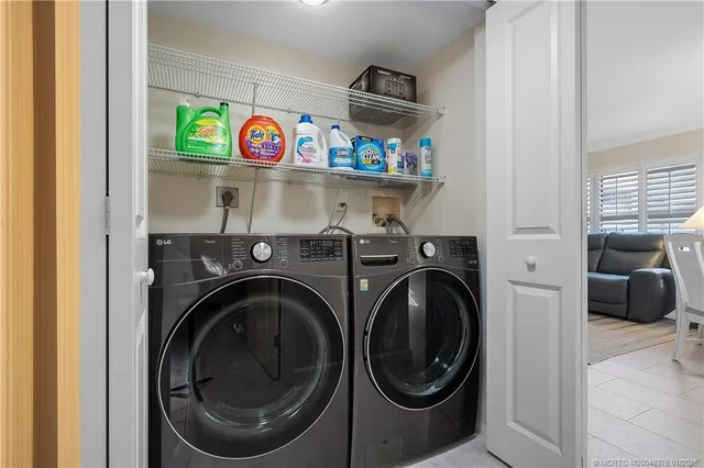 a view of storage and utility room with washer and dryer