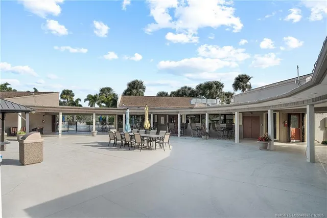 a front view of house with outdoor seating