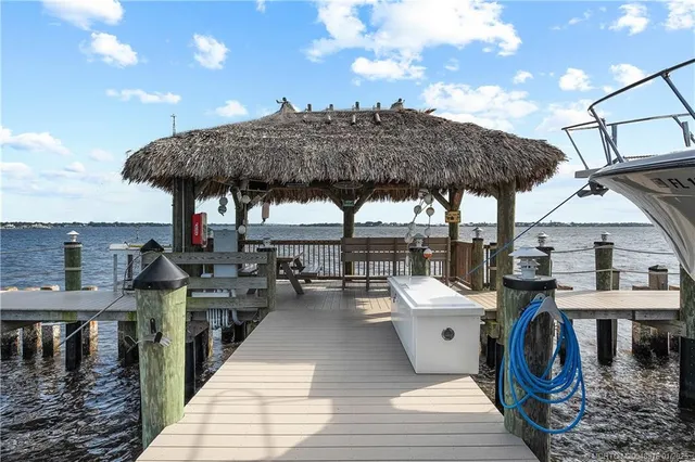 a view of a patio with chairs and a table