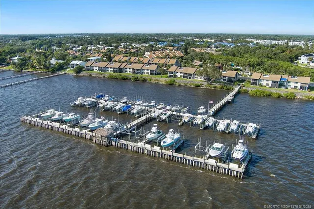 an aerial view of a residential houses with outdoor space