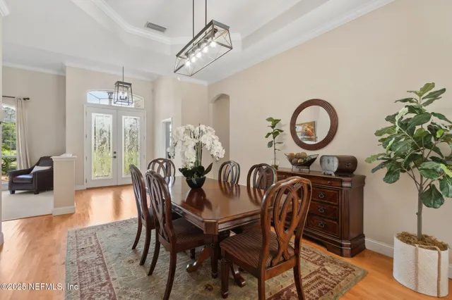 a kitchen with stainless steel appliances granite countertop a sink a stove and refrigerator