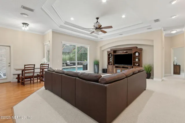 a view of a dining room with furniture and wooden floor
