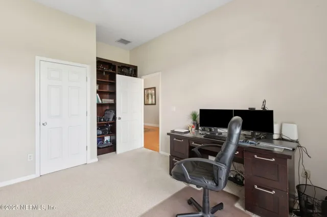 an aerial view of a house with a ocean view