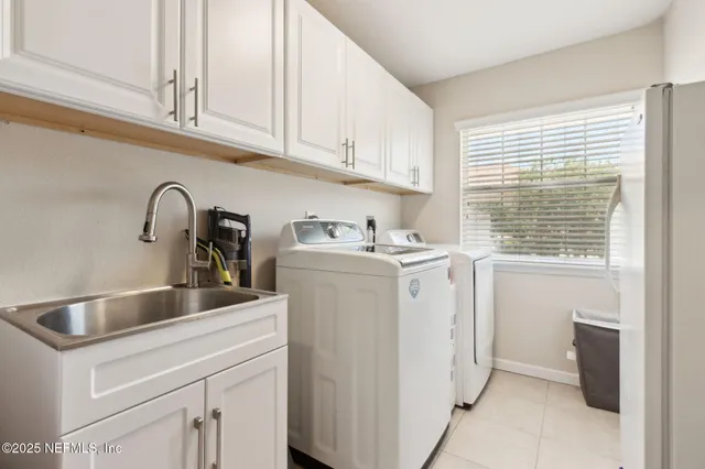a living room with lots of furniture and floor to ceiling window