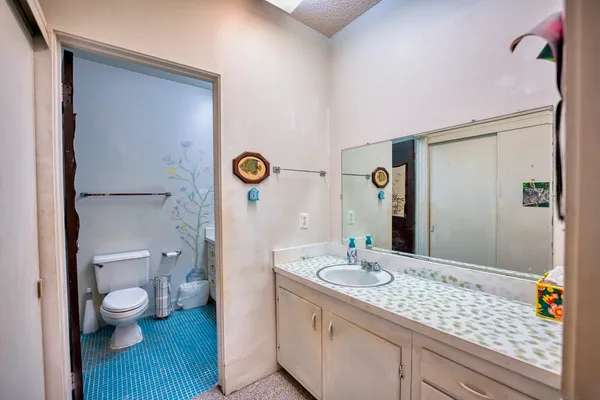 a bathroom with a white bath tub and a shower