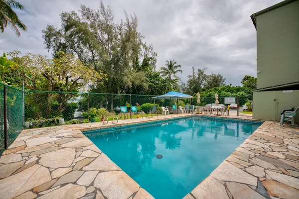 a view of a swimming pool with a patio