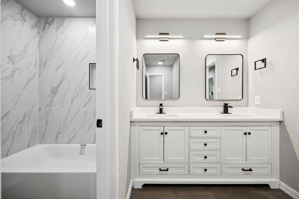 10 Chisholm Trail Lucas, TX 75002 - Photo 29 of 40 a bathroom with a double vanity sink mirror and bathtub