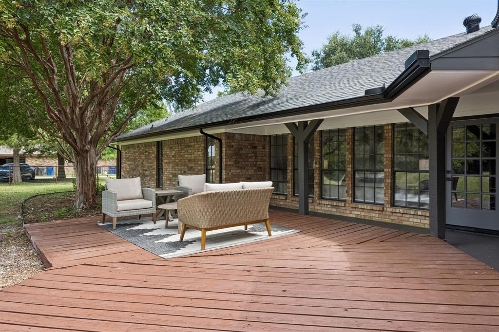 10 Chisholm Trail Lucas, TX 75002 - Photo 34 of 40 a view of a patio with table and chairs with wooden floor and fence