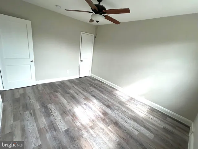 an empty room with fan