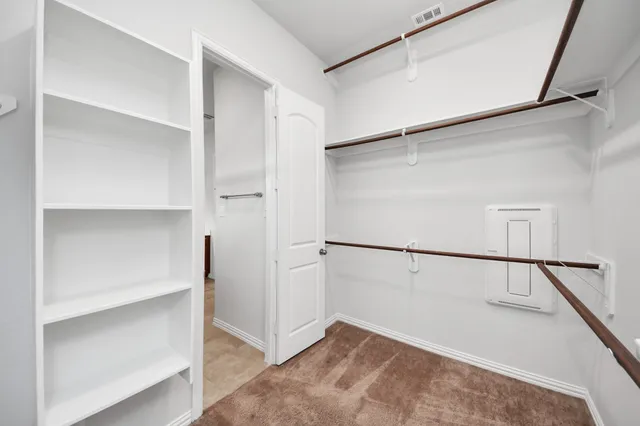 a view of an empty walk in closet