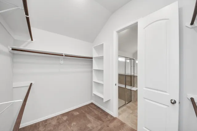 a view of an empty walk in closet