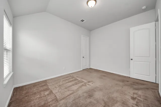 an empty room with an entryway