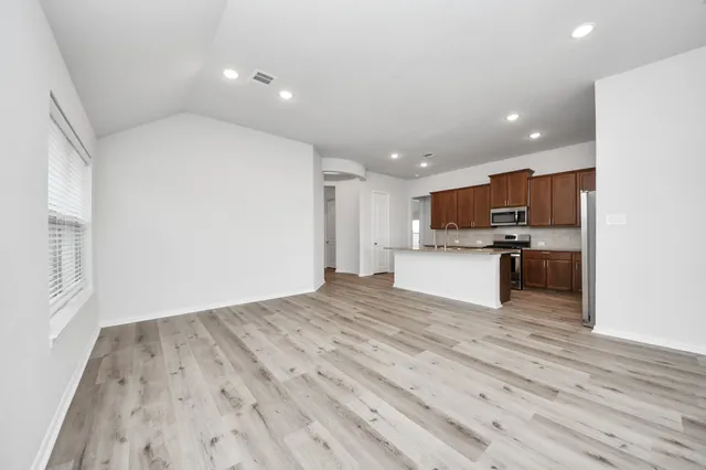 a view of kitchen with wooden floor