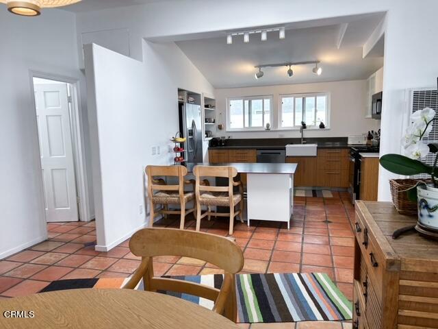 213 Rossmore Drive Oxnard, CA 93035 - Photo 12 of 28 a living room with furniture a fireplace and kitchen view