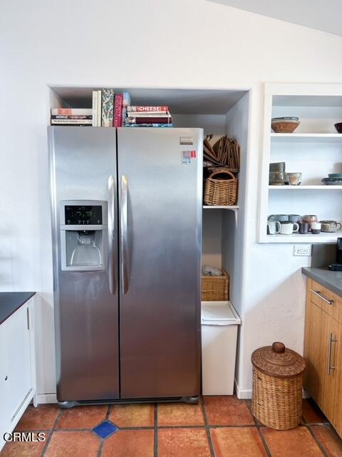 213 Rossmore Drive Oxnard, CA 93035 - Photo 15 of 28 a kitchen with a refrigerator and cabinets