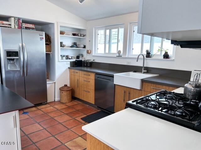 213 Rossmore Drive Oxnard, CA 93035 - Photo 20 of 28 a kitchen with stainless steel appliances a sink a stove a refrigerator and cabinets