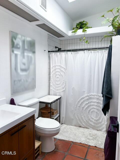 213 Rossmore Drive Oxnard, CA 93035 - Photo 24 of 28 a bathroom with a granite countertop bathtub sink vanity mirror and toilet