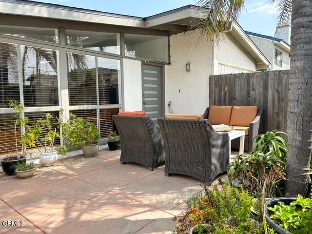 213 Rossmore Drive Oxnard, CA 93035 - Photo 3 of 28 a backyard of a house with seating space